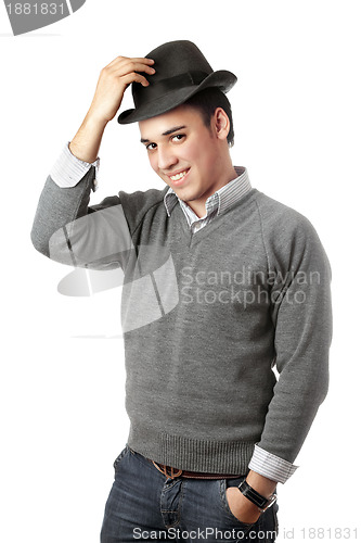 Image of Smiling attractive young man wearing black hat