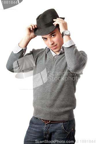 Image of Attractive young man wearing black hat