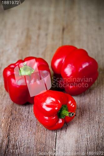 Image of three red bell peppers