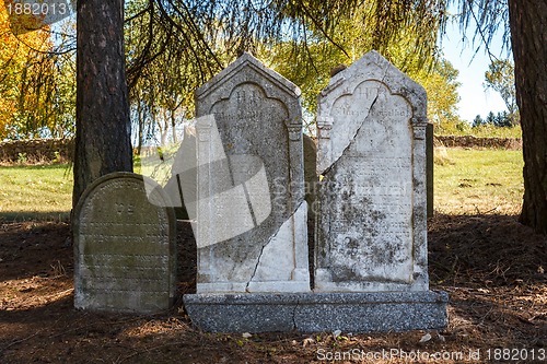 Image of forgotten and unkempt Jewish cemetery with the strangers