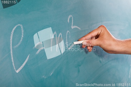 Image of Einstein's Formula E=mc2 on a blackboard