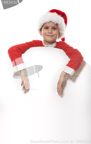 Image of Boy holding a christmas poster 