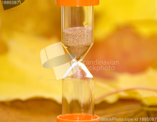 Image of Autumn background and sandglass 