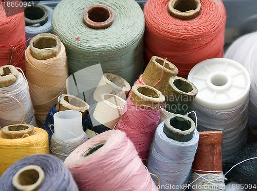 Image of Many different reels of thread for sew 