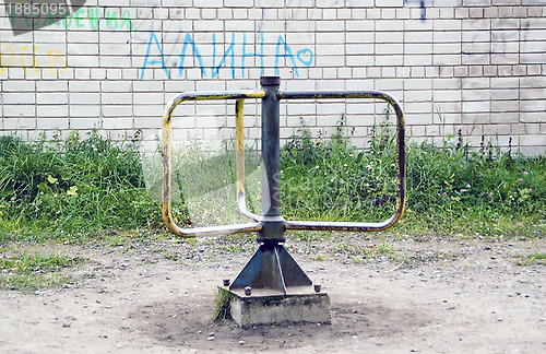 Image of Old children's carousel in the yard