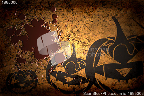 Image of Scary Jack O Lantern halloween pumpkin on  grunge background with blood