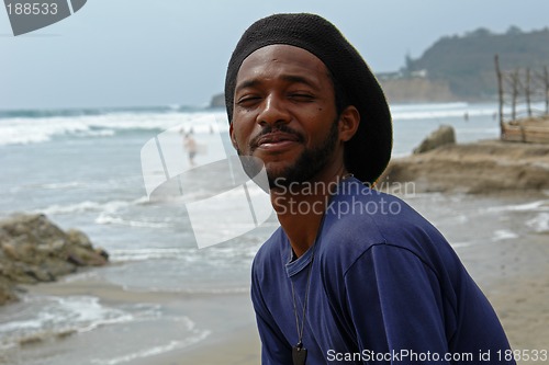 Image of happy rasta-man on the beach of pacific ocean