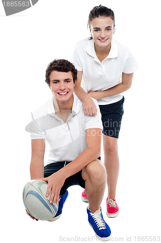 Image of Charming football team players in sports attire