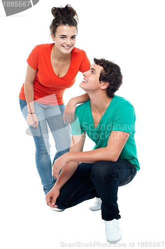 Image of Adorable teenage love couple posing together