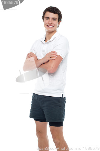 Image of Cute guy posing with crossed arms