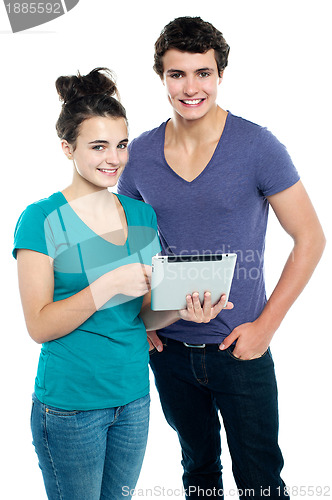 Image of Technology savvy couple browsing newly launched tablet