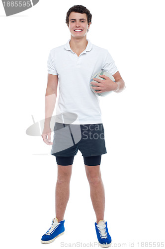 Image of Energetic football player holding ball tightly