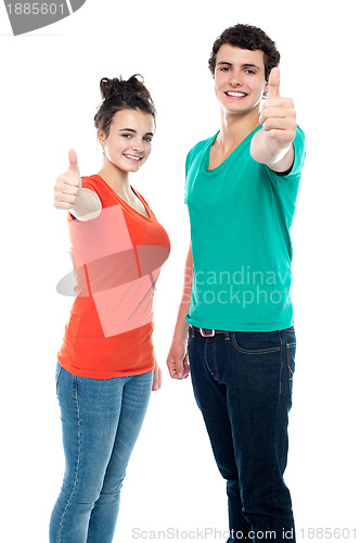 Image of Teen love couple showing thumbs up to camera