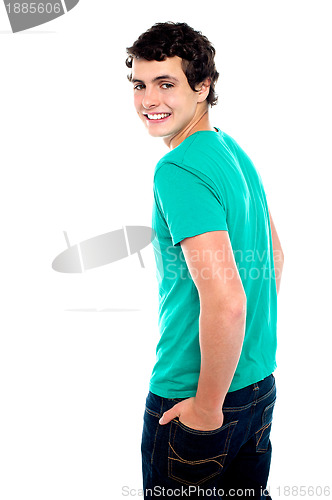 Image of Fashionable young guy turning back