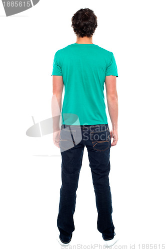 Image of Rear view of teen guy in casuals