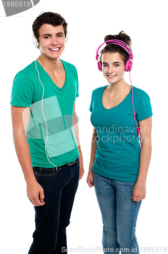 Image of Friends enjoying music together via headphones