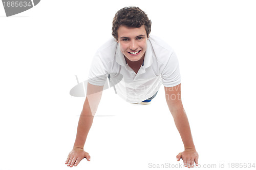 Image of Active sports guy doing push ups