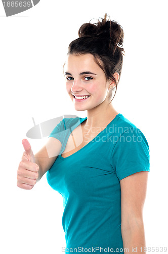 Image of Gorgeous pretty girl showing thumbs up to you