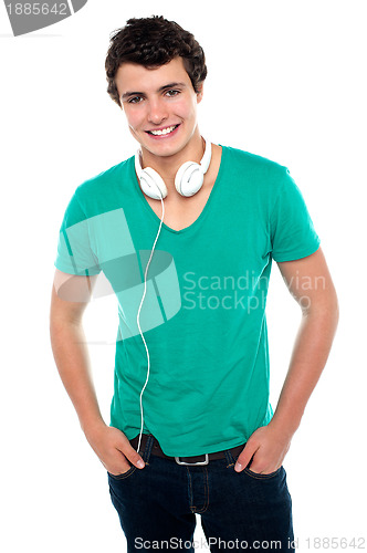 Image of Cool trendy teenager boy with headphones around his neck