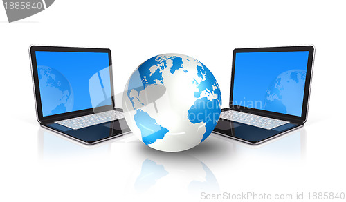 Image of two Laptop computers around a world globe