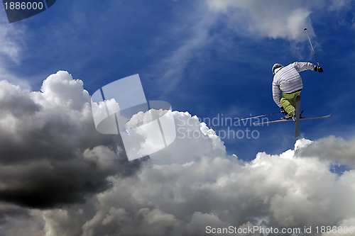 Image of Freestyle ski jumper with crossed skis