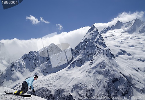 Image of Snowboarder descends a slope