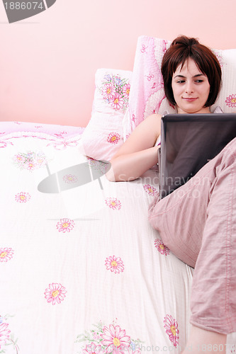 Image of Young woman with laptop 