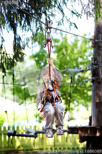 Image of little boy ziplining