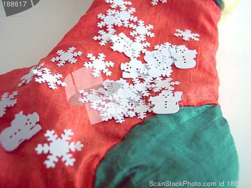 Image of santa's sock and snowflakes
