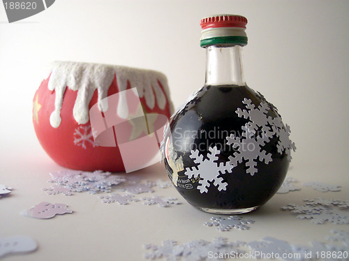 Image of xmas candle and liquor bottle