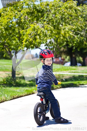 Image of toddler on a balance bike