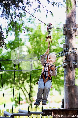 Image of little boy ziplining