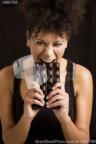 Image of Woman eating chcolate
