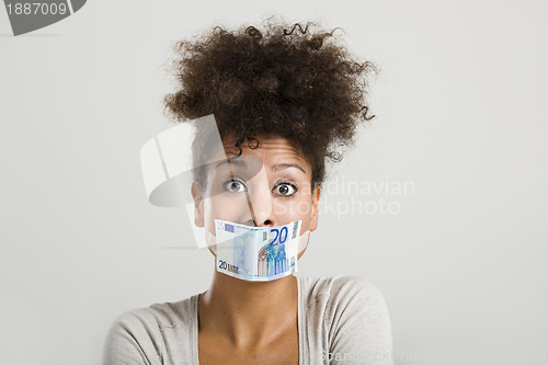 Image of Covering mouth with a euro banknote