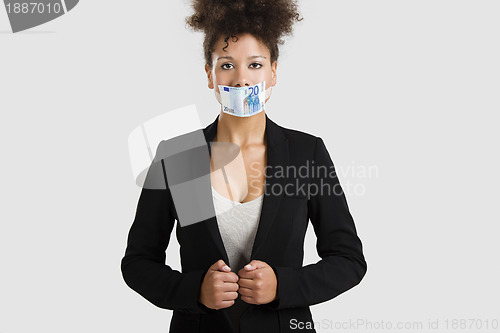 Image of Covering mouth with a euro banknote