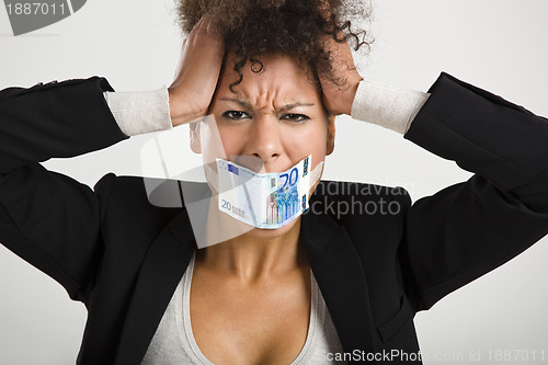 Image of Covering mouth with a euro banknote