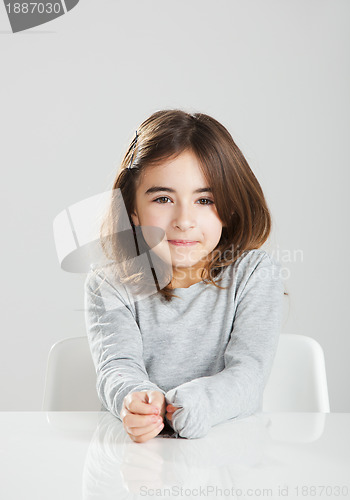 Image of Little girl in a desk