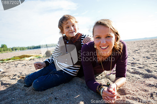 Image of Mother and son at beach.