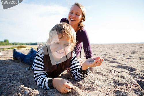 Image of Mother and son at beach.