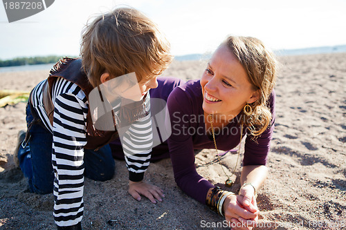 Image of Mother and son at beach.