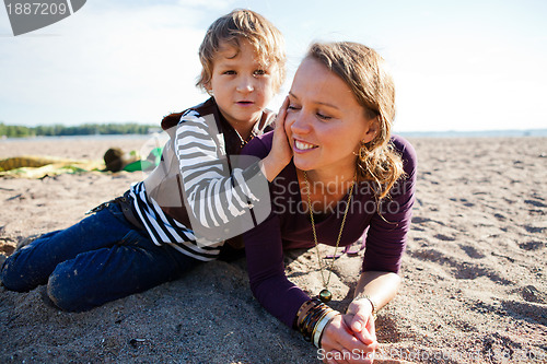Image of Mother and son at beach.