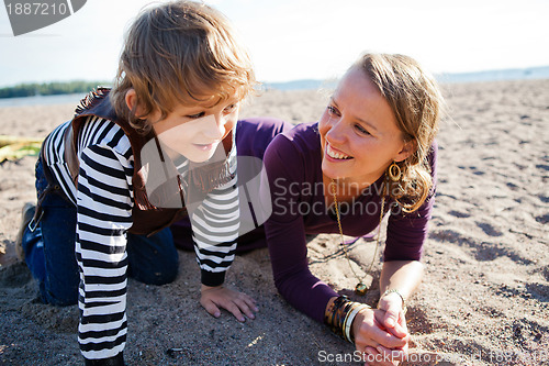 Image of Mother and son at beach.