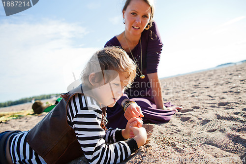 Image of Mother and son at beach.