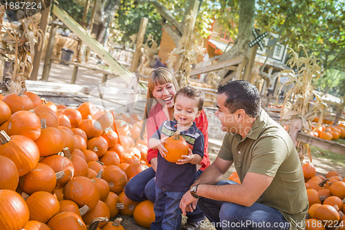Image of Happy Mixed Race Family at the Pumpkin Patch
