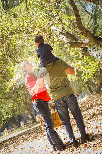 Image of Mixed Race Family Enjoy a Walk in the Park