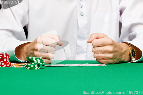 Image of chips, cards and fists men