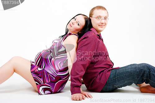 Image of Young couple. A pregnant woman and a man