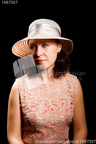 Image of An attractive woman in a hat