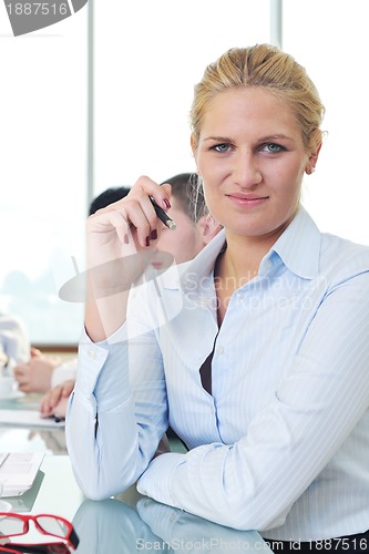 Image of young business woman on meeting