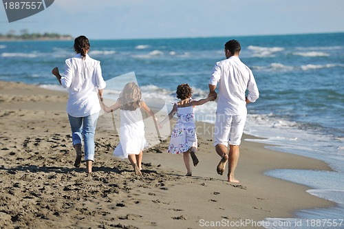 Image of happy young  family have fun on beach